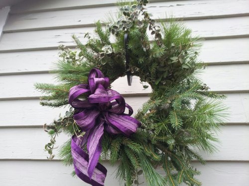 sustainable handmade balsam wreath with eucalyptus and purple irredescent bow